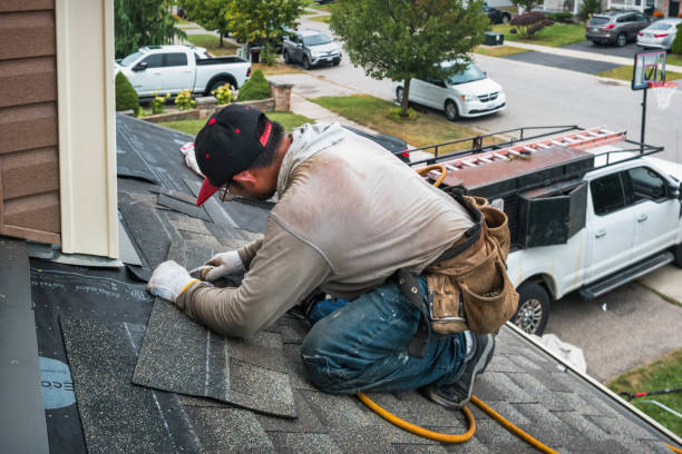 Professional Roof Replacement technician working in Foster, RI
